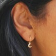 Close Up Model Shot of Gold Sterling Silver Moon Charm Huggie Hoop Earrings