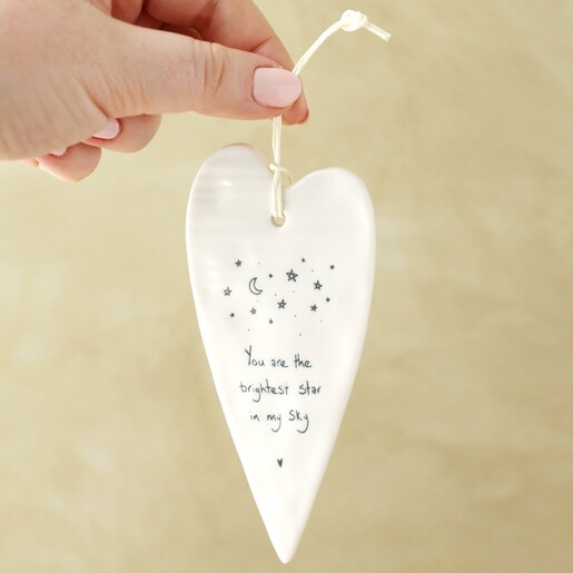 Model holding up Brightest Star Hanging Heart Decoration