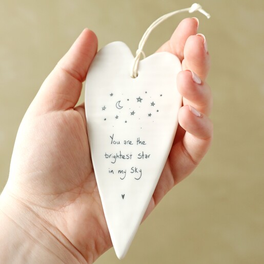 Model holding Brightest Star Hanging Heart Decoration