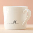 East of India Perfect Day To Do Nothing Mug Showing Etched Details with Pink Backdrop