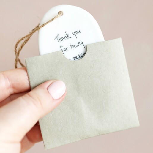 Model Holding East of India Sgraffito Thank You Hanging Decoration in Packaging