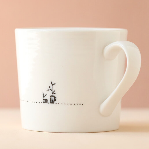 Etched Plants on Side of East of India Strong Women Make Waves Mug with Pink Backdrop