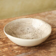 East of India Organic Shaped Trinket Bowl sat on wooden table