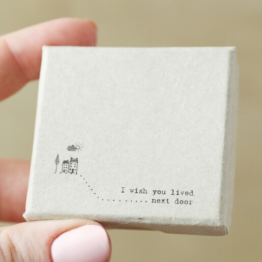 Front of box for East of India Wish You Lived Next Door House Ornament