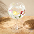Tulip Balloon Gin Glass on a Wooden Table