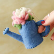 model holding Felt Blossoming Watering Can Hanging Decoration by the watering can handle