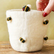 model touching Felt Honey Bee Plant Pot in White