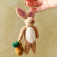 model using string to hold Felt Rory the Rabbit Hanging Decoration