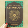Model Holding A Little Bit of Astrology Book 