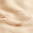 Rose Gold Feather Bracelet on fabric