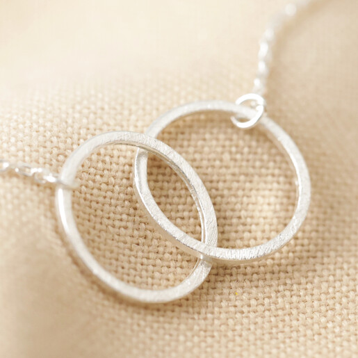 Close-up of Lisa Angel Brushed Silver Interlocking Hoop Necklace