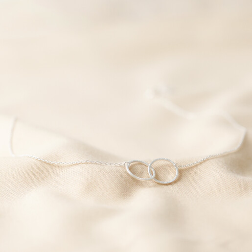 Lisa Angel Brushed Silver Interlocking Hoop Necklace on White Background