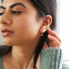 Crystal Eye Huggie Hoop Earrings on Model