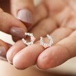 Model Holding Crystal and Opal Horseshoe Stud Earrings in Silver