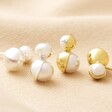Double Half Pearl Stud Earrings in Gold and Silver on Fabric