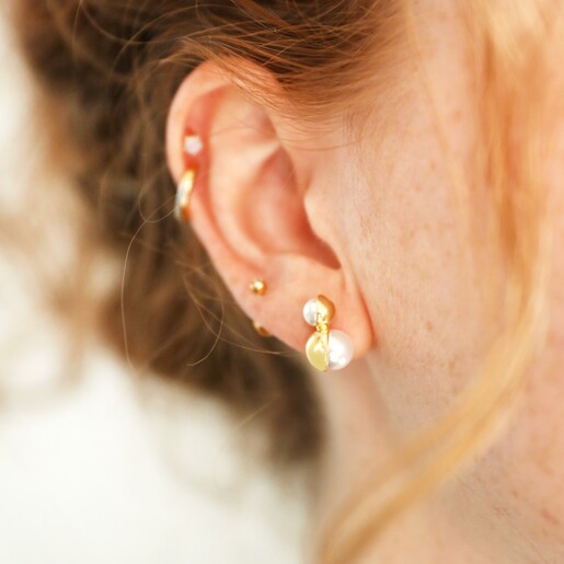 Double Half Pearl Stud Earrings in Gold on Model