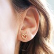 Model Wearing Irregular Heart Crystal Stud Earrings in Gold