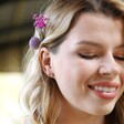 Irregular Crystal Heart Stud Earrings in Rose Gold on Fabric