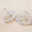 Irregular Crystal Heart Stud Earrings in Silver on Fabric