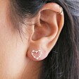 close up of model wearing outline stud from Mismatched Crystal Heart Earrings in Silver