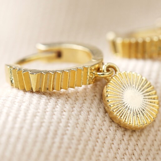 Close-up of Gold Sun Huggie Hoop