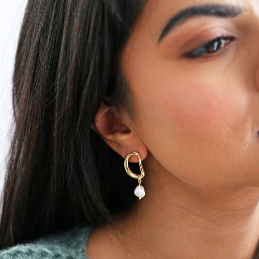 Model Wearing Organic Circle Pearl Drop Earrings in Gold