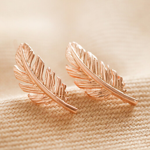 Gold feather stud on sale earrings