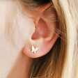 Model Wearing Tiny Butterfly Stud Earrings in Silver