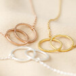 Rose Gold, Gold and Silver Brushed Interlocking Hoop Necklaces on Fabric