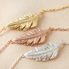 Close Up of Silver Feather Necklace With Gold and Rose Gold Options