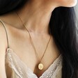 Gold Stainless Steel Coin Pendant Necklace on Female Model
