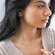 model wearing Gold Stainless Steel Rainbow Crystals Necklace