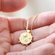 Model Holding Personalised Reversible Day and Night Necklace in Gold