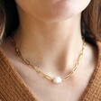 Model Wearing Short Gold Cable Chain and Pearl Necklace