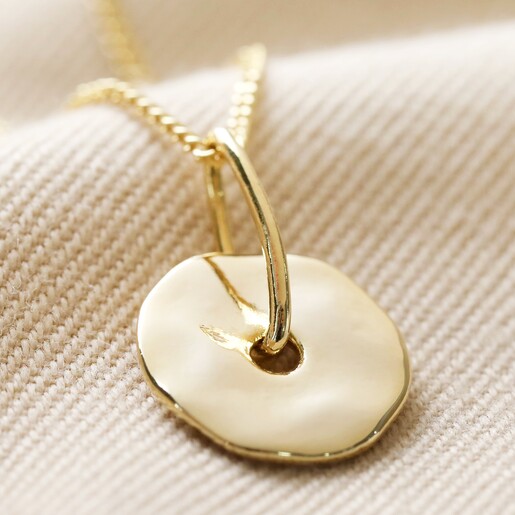 Spinning Disc Pendant Necklace in Gold Close-up