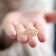 Model Holding Crystal Leaves Ring in Gold