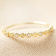 Gold Plated Sterling Silver Dotted Crystal Band Ring on Beige Fabric