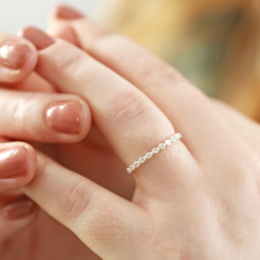 Model Wearing Sterling Silver Dotted Crystal Band Ring on Ring Finger