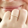 Smiling Model Wearing Sterling Silver Dotted Crystal Band Ring