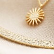 Close Up Of Hammered Detail on Sun and Horn Layered Necklace in Gold