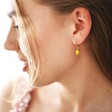 Enamel Lemon Huggie Hoop Earrings in Gold on Model