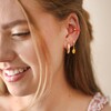 Model Wearing Enamel Lemon Huggie Hoop Earrings in Gold With Gold Hoops