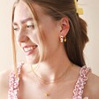 Model Wears Enamel Lemon Huggie Hoop Earrings in Gold with Cloisonne Hoops