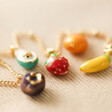 Enamel Fruit Charm Necklace in Gold on Fabric
