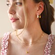 Model Wears Enamel Lemon Pendant Necklace in Gold With Other Pieces