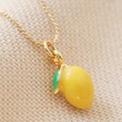 Close Up of Lemon on Enamel Lemon Pendant Necklace in Gold
