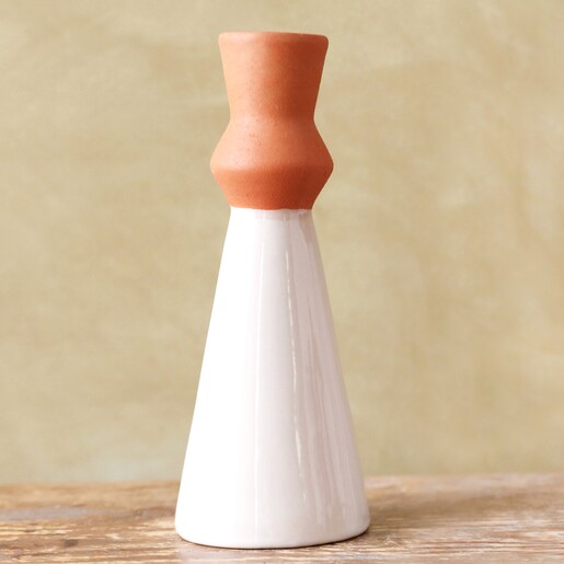 Single White Candle Holder on Wood Surface