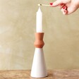 Model Lighting Candle in Single White Candle Holder