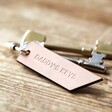 Personalised Banner Leather Keyring on Wooden Table