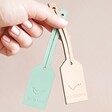 Model Holding Pink and Green Personalised Constellation Leather Luggage Tags
